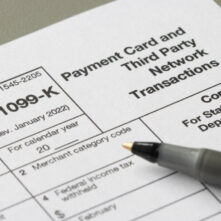 Closeup of Form 1099-K, Payment Card and Third Party Network Transactions, an IRS information return used to report certain payment transactions to improve voluntary tax compliance.
