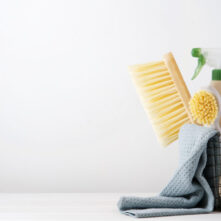 Eco brushes, sponges and rag in cleaning basket. Cleaner concept
