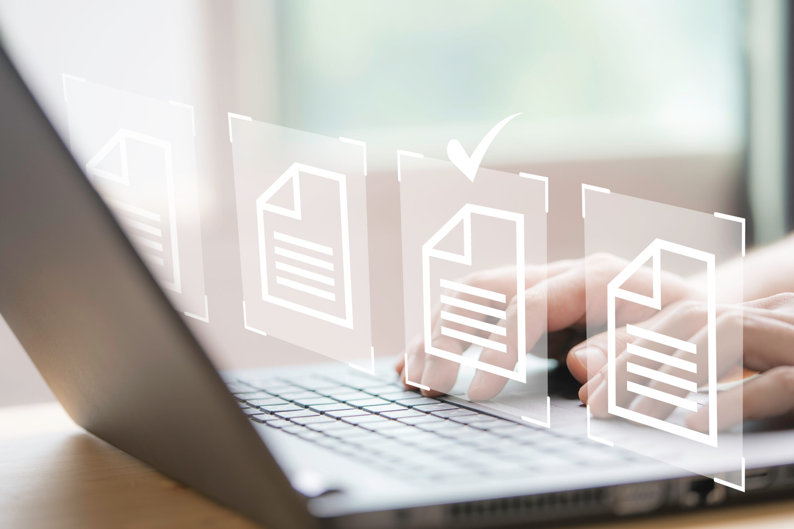 Hand using laptop computer with virtual screen and document for online approve paperless quality assurance and ERP management concept.